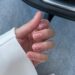 Нежно-розовый летний маникюр на коротких овальных ногтях с мелкими голубыми стразами